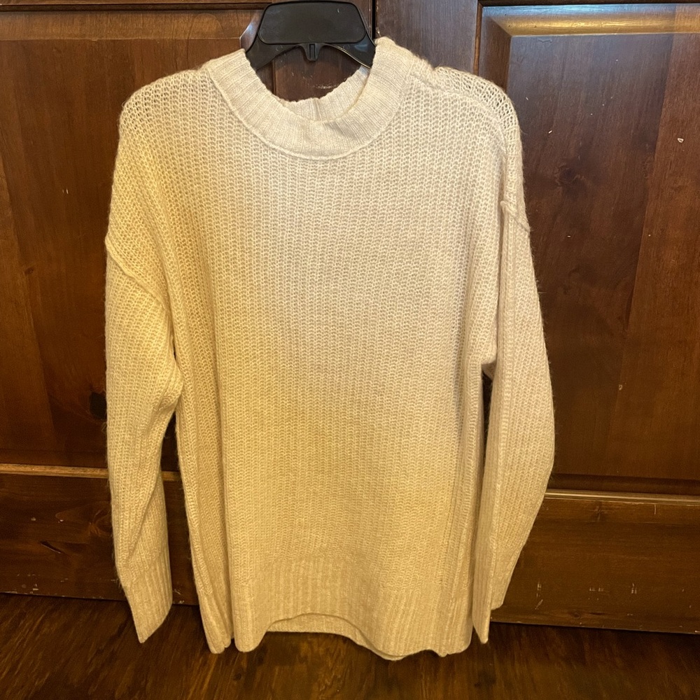 Oversized beige women’s sweater.